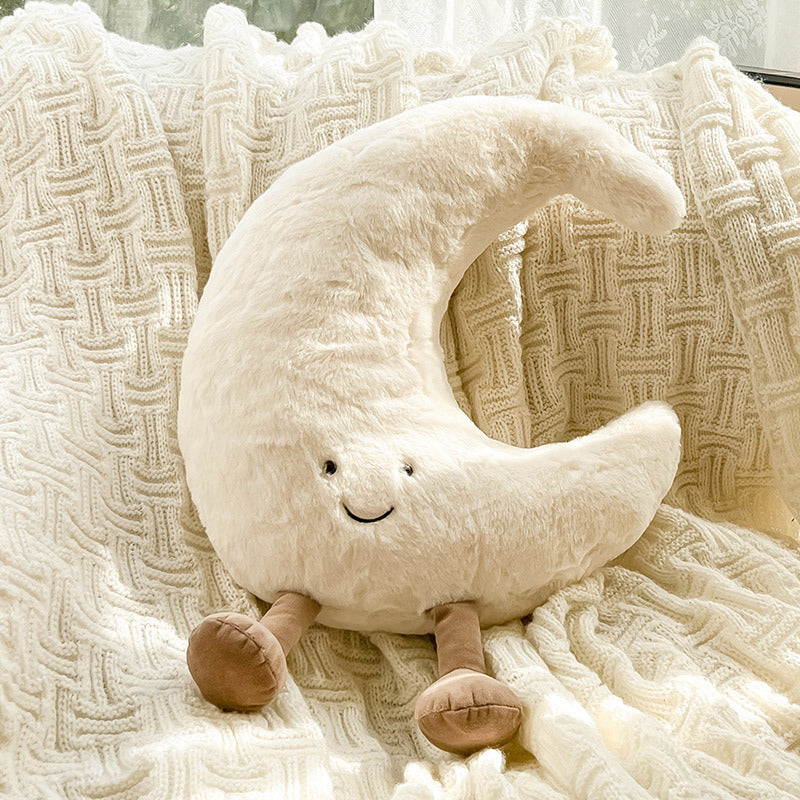 Peluche lua creme em cama macia