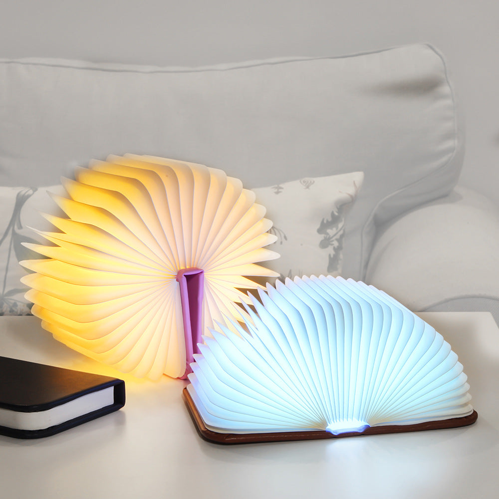 Candeeiro livro aberto, luz quente em leque